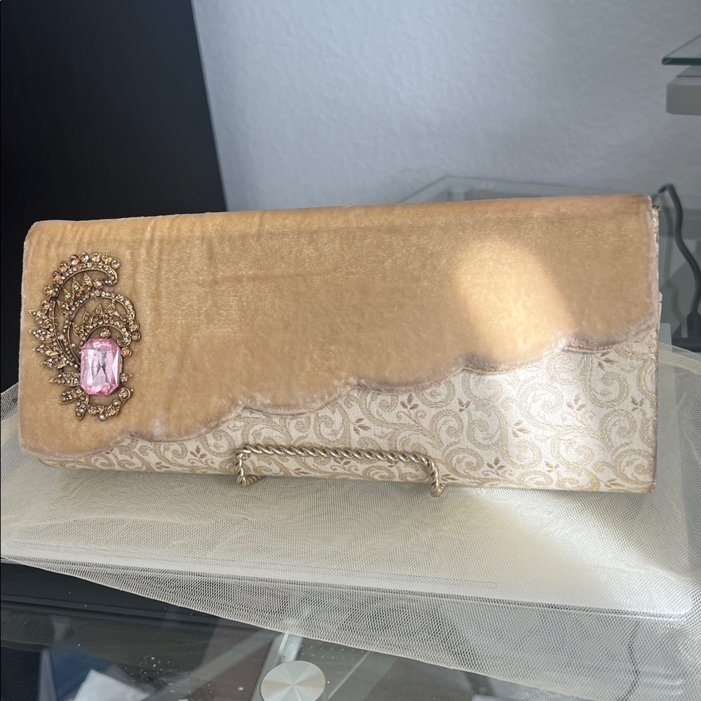 Elegant Tan Clutch with Pink Gemstone Accent
